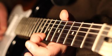 Learning to play the electric guitar